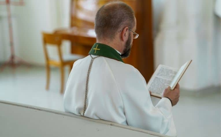 Lutheran priest reading a Bible