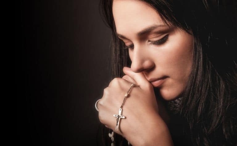 woman rosary prayer