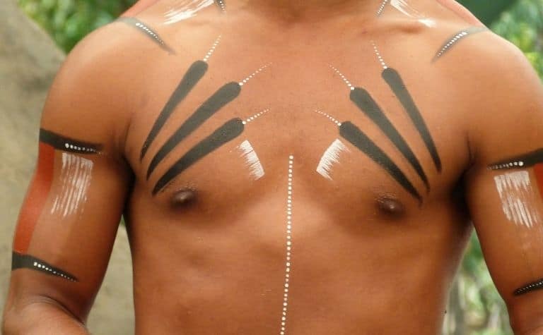 man with tribal tattoos