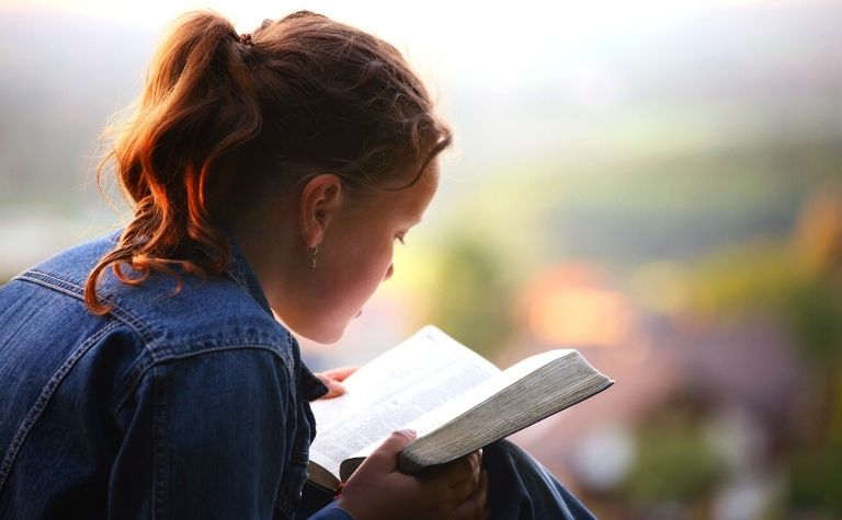 Girl reading Bible